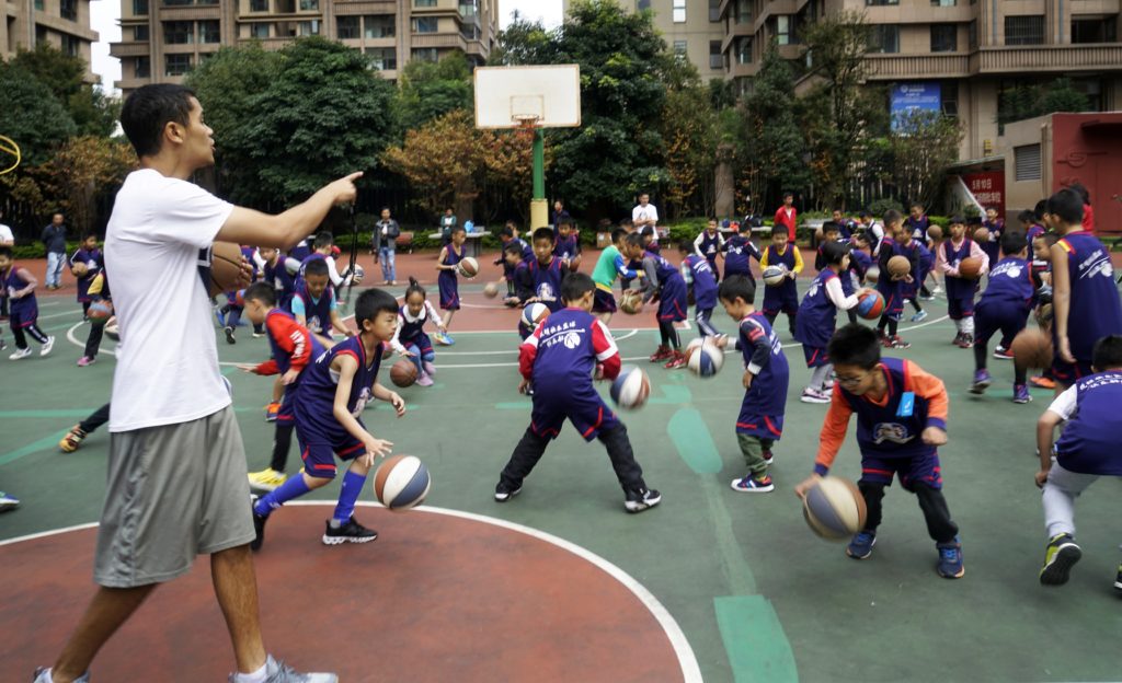 Coach Dip and Coach Tim developing young players in Kunming, China.